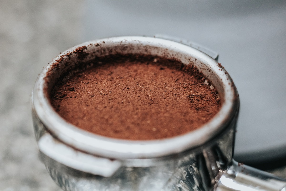  tamped coffee in a portafilter