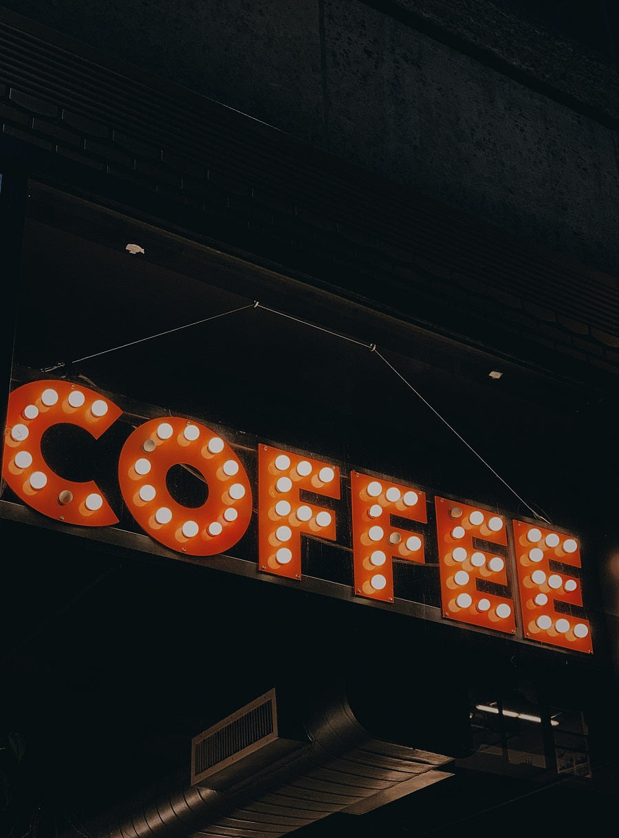 sign that says coffee in lights