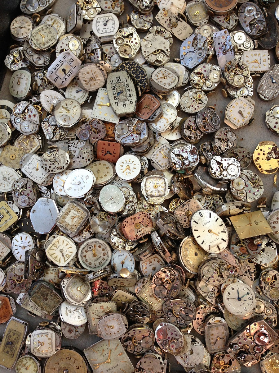 hundreds of watch faces in large pile