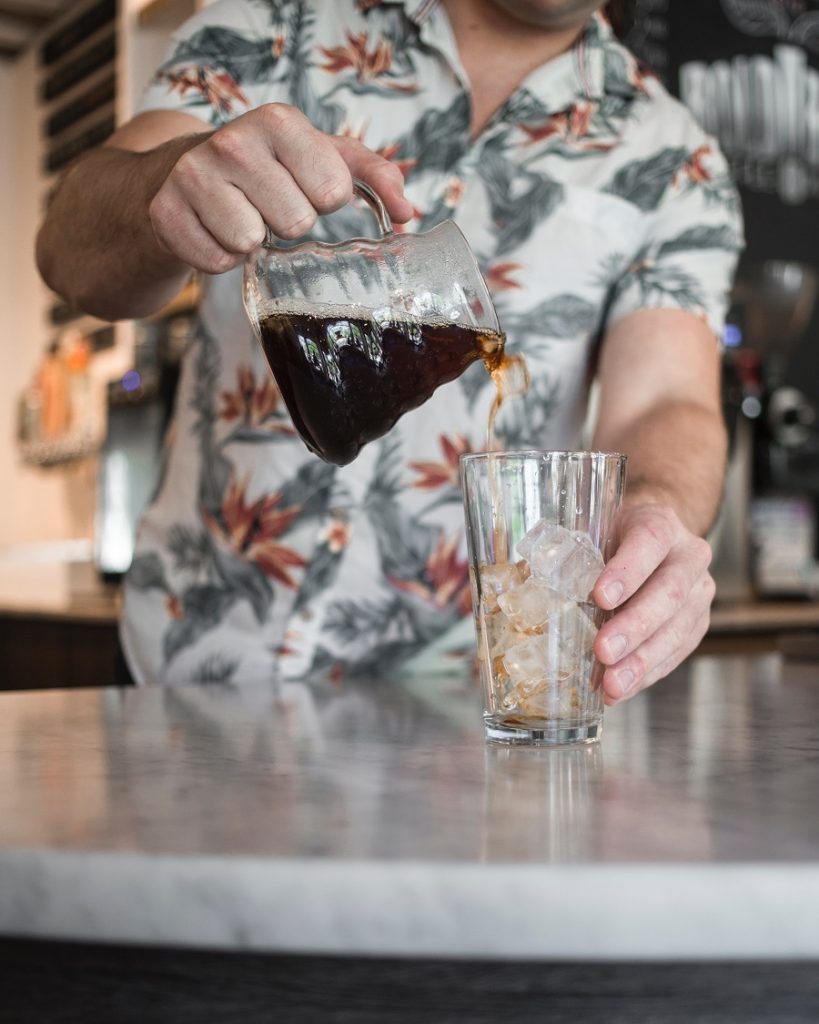 hot coffee poured over ice