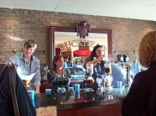 Batdorf staff demonstrating two different brewing methods siphon and Chemex