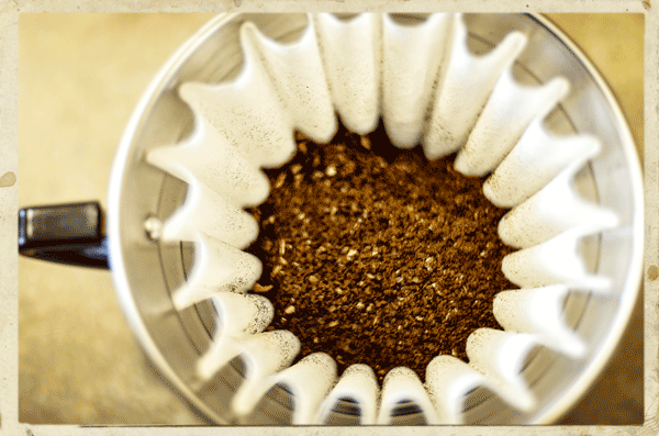 Ground coffee seen from above in a kalita wave manual brewer